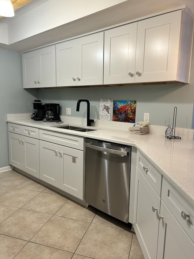 kitchen featuring white cabinetry, dishwasher, light tile patterned floors, and sink