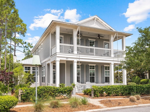 view of front of property featuring ceiling fan, a porch, and a balcony