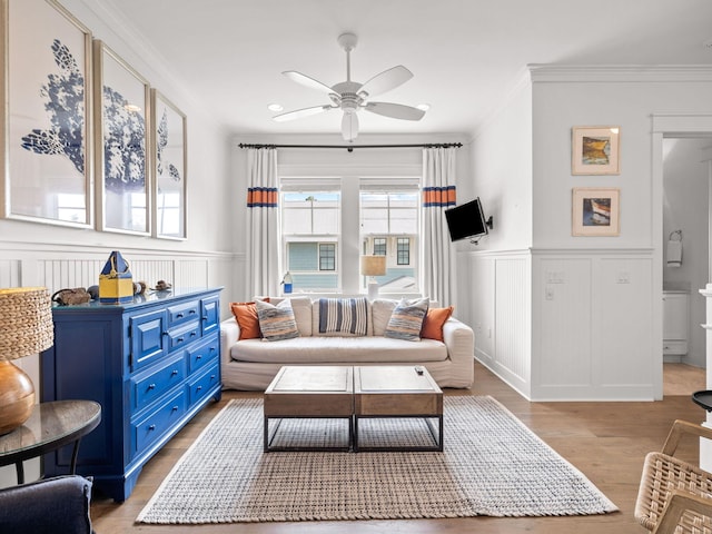 interior space with ceiling fan, light hardwood / wood-style floors, and crown molding