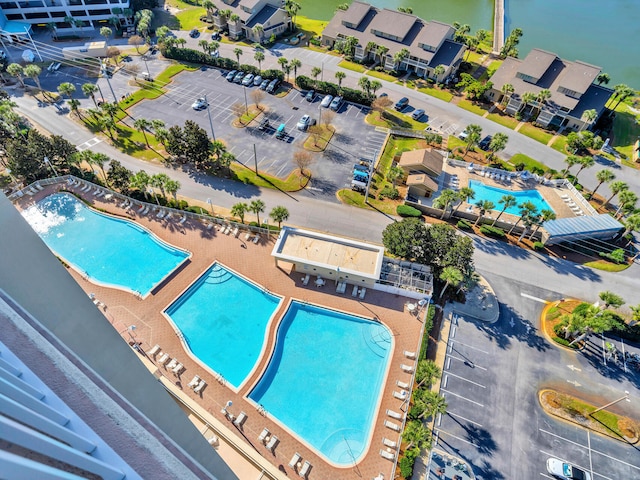 birds eye view of property with a water view