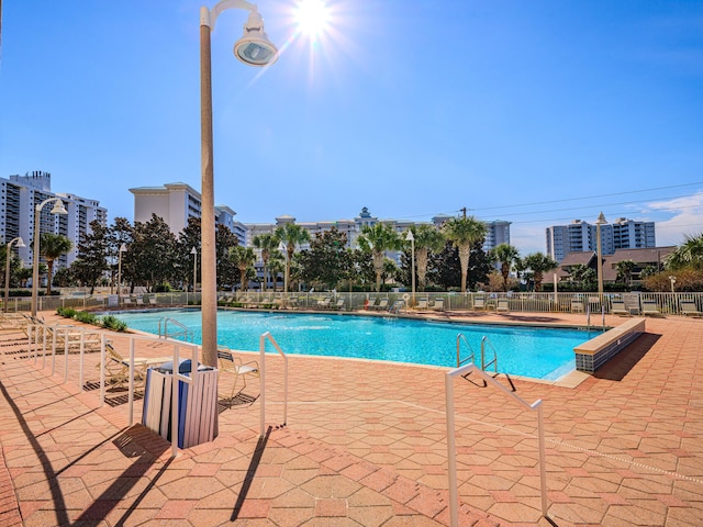 view of swimming pool featuring a patio area