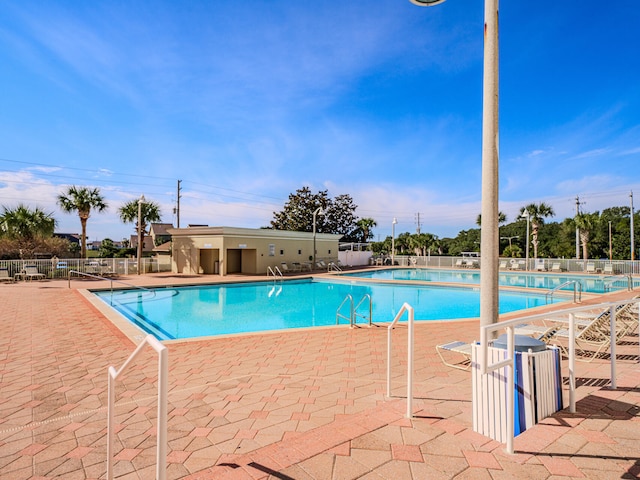 view of swimming pool with a patio area