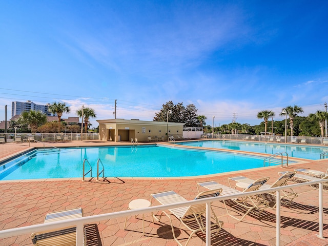 view of swimming pool with a patio area