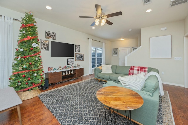 living room with ceiling fan and wood-type flooring