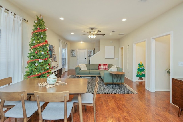 dining space featuring hardwood / wood-style flooring and ceiling fan