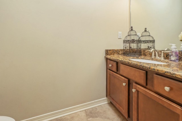 bathroom with tile patterned floors and vanity