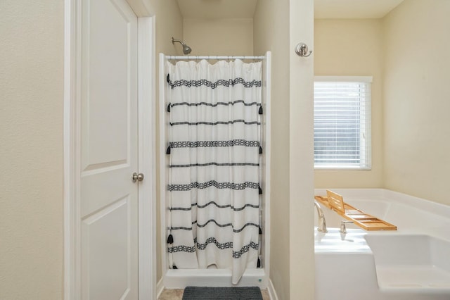 bathroom featuring plus walk in shower