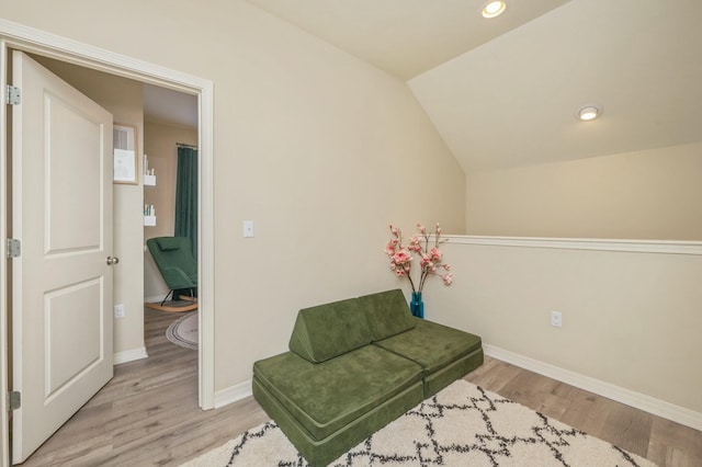 sitting room featuring light hardwood / wood-style flooring and vaulted ceiling