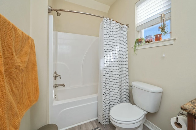 bathroom featuring toilet, shower / bath combo, and hardwood / wood-style flooring