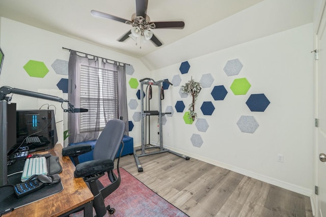 office space featuring ceiling fan, hardwood / wood-style floors, and lofted ceiling