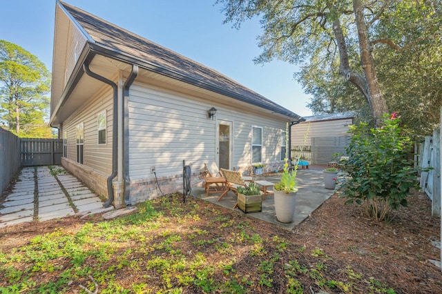 back of property with a patio area