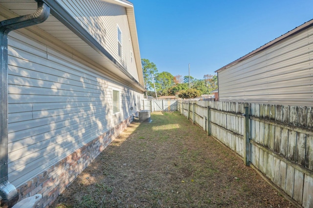 view of yard with central air condition unit