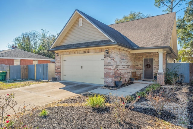 1305 Finck Rd, Niceville, FL 32578 - view of front of property featuring brick siding, driveway, roof with shingles, and an attached garage
