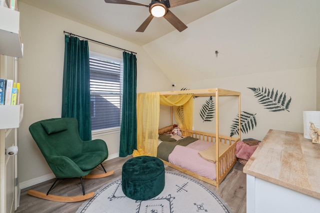 1305 Finck Rd, Niceville, FL 32578 - bedroom featuring light wood finished floors, vaulted ceiling, and ceiling fan