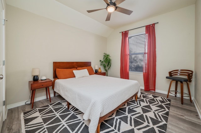 1305 Finck Rd, Niceville, FL 32578 - bedroom featuring wood finished floors, lofted ceiling, and a ceiling fan