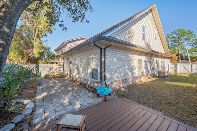 1305 Finck Rd, Niceville, FL 32578 - back of property with a fenced backyard, a patio, a wooden deck, and a gate