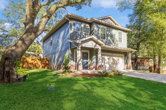 view of front of house featuring a front lawn and a garage