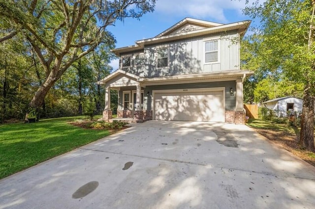 view of front of property featuring a garage and a front lawn