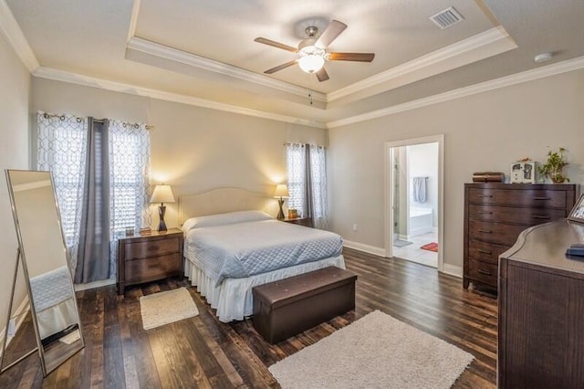 bedroom with connected bathroom, ceiling fan, dark hardwood / wood-style flooring, and ornamental molding