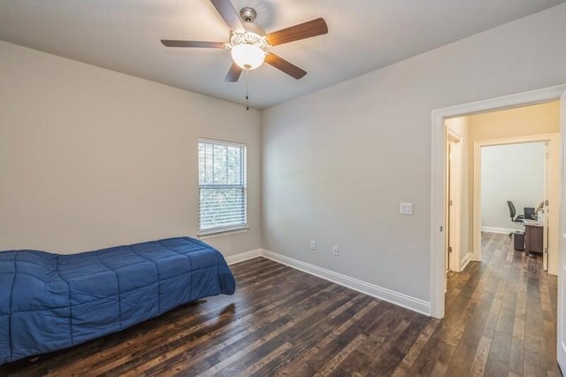 bedroom featuring ceiling fan and dark hardwood / wood-style flooring