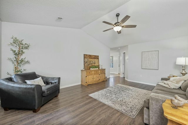 living room featuring ceiling fan, dark hardwood / wood-style flooring, a textured ceiling, and vaulted ceiling