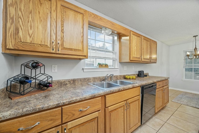 kitchen with sink, light tile patterned floors, pendant lighting, a notable chandelier, and black dishwasher