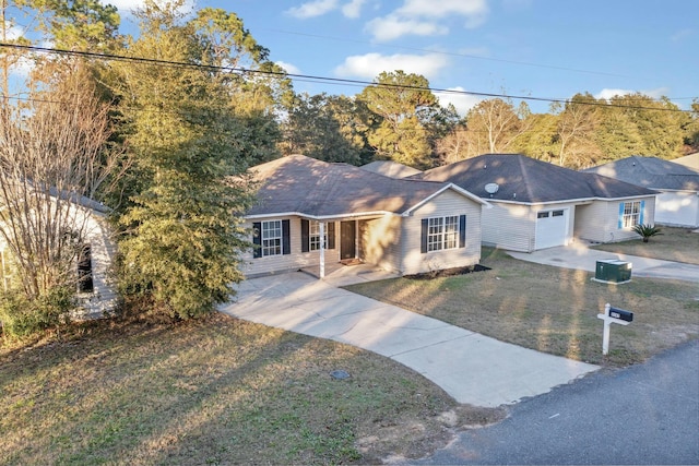 ranch-style home with a garage and a front yard