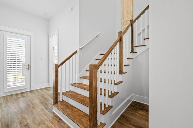 stairway with wood-type flooring