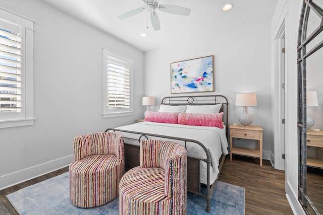 bedroom with ceiling fan and dark hardwood / wood-style floors