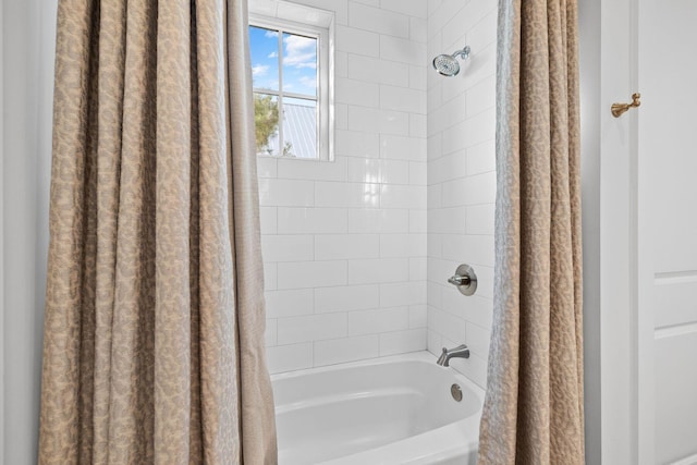 bathroom featuring shower / bath combo with shower curtain