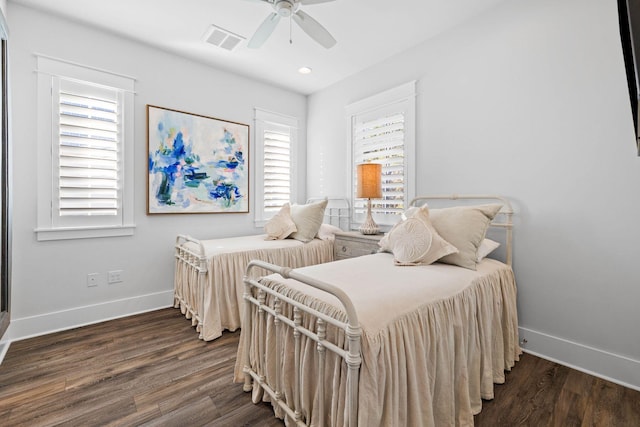 bedroom featuring ceiling fan and dark hardwood / wood-style floors