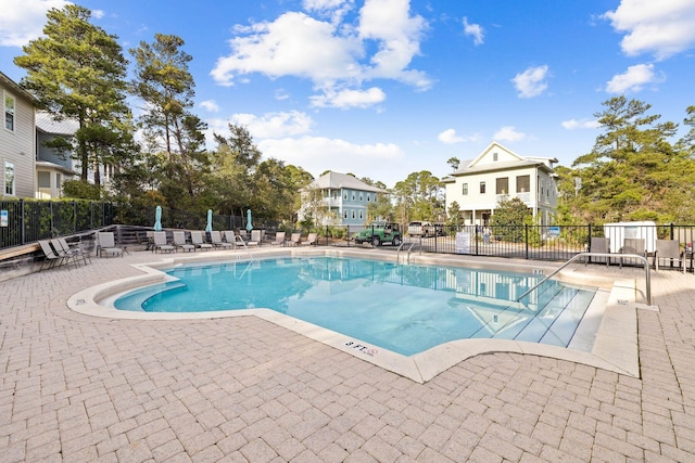 view of swimming pool with a patio area