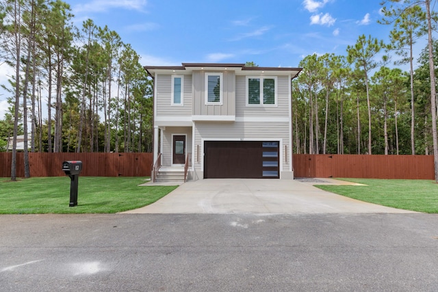 view of front facade with a front lawn and a garage