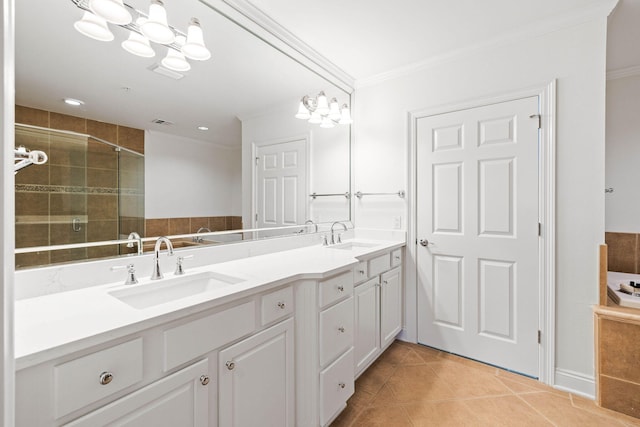 bathroom featuring tile patterned floors, vanity, crown molding, and walk in shower