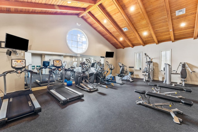 exercise room with high vaulted ceiling and wood ceiling