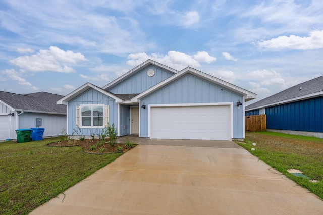 view of front of house with a garage and a front lawn