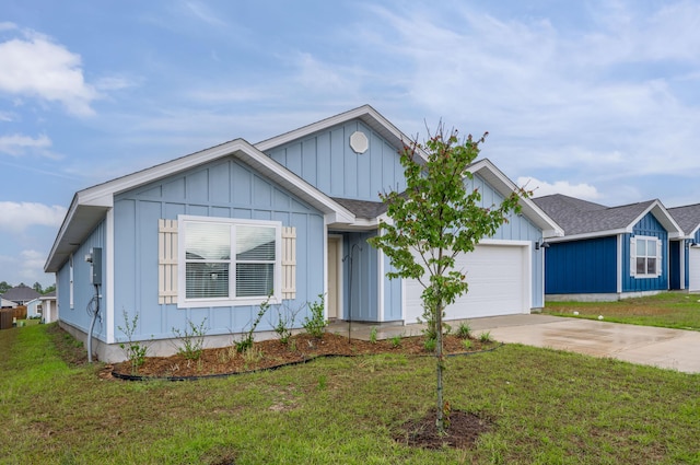 view of front of house with a garage and a front lawn