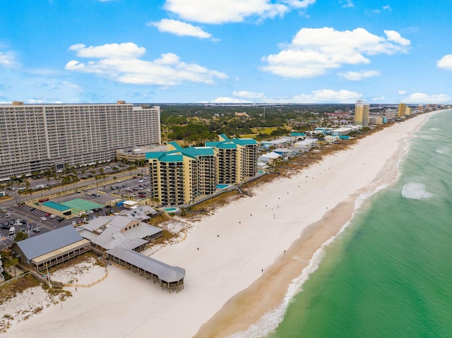 drone / aerial view with a beach view and a water view