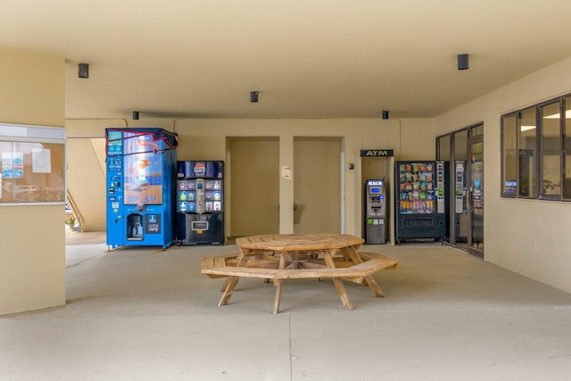 dining area featuring concrete flooring