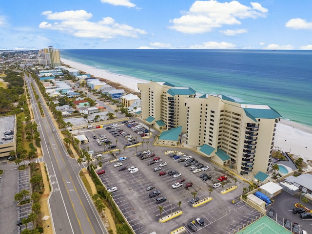 drone / aerial view featuring a view of the beach and a water view