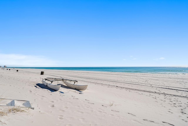 property view of water featuring a beach view