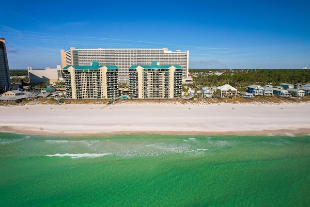 drone / aerial view featuring a view of the beach and a water view