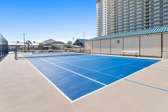 view of tennis court featuring basketball court