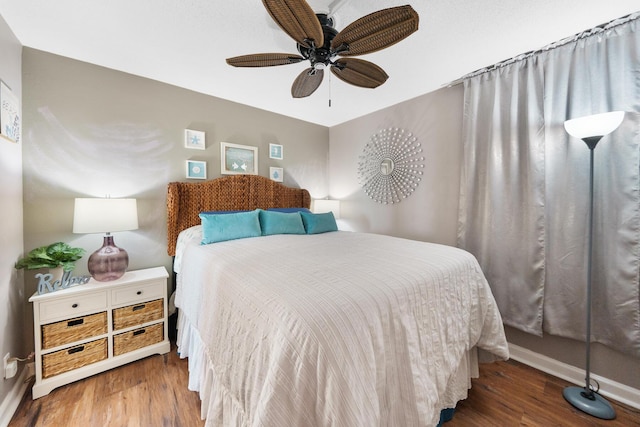 bedroom featuring hardwood / wood-style floors and ceiling fan