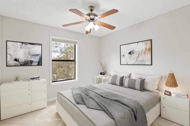 bedroom with light tile patterned floors and a ceiling fan