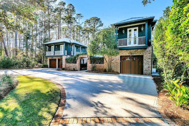 view of front of house with a balcony and a garage