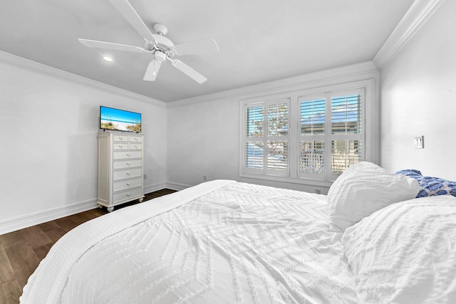 bedroom with ceiling fan, dark wood-type flooring, and ornamental molding