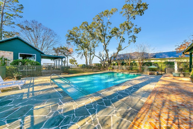 view of pool featuring a patio