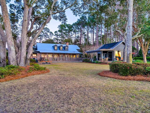 view of front facade with a front lawn and a porch