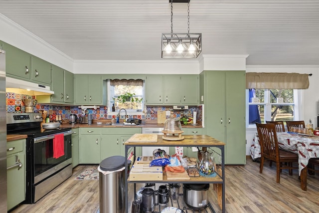 kitchen with green cabinets, crown molding, sink, and stainless steel range with electric stovetop